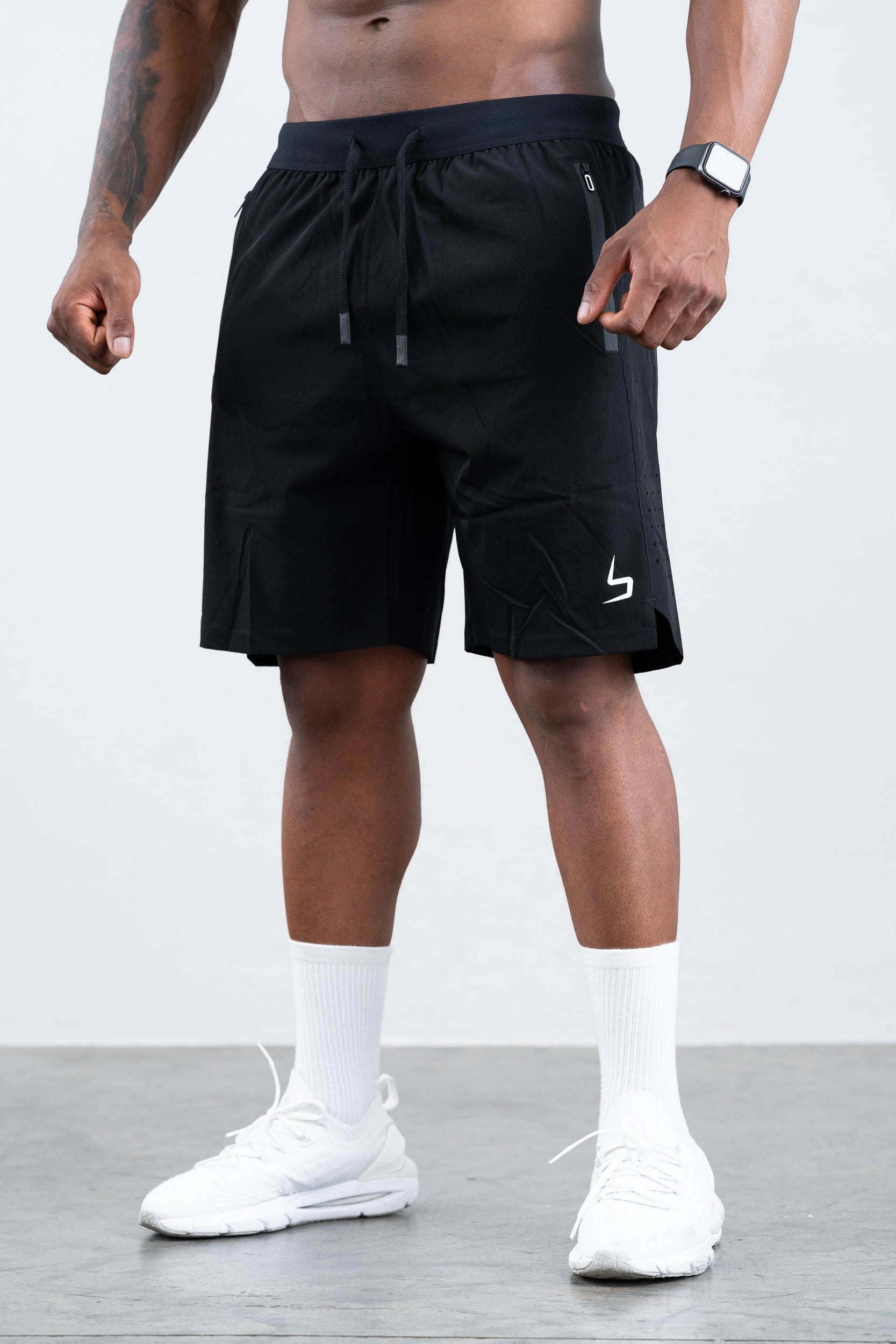 man wearing botthms black training sport short
